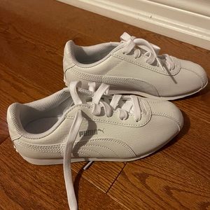 Girls’ all white Puma sneakers